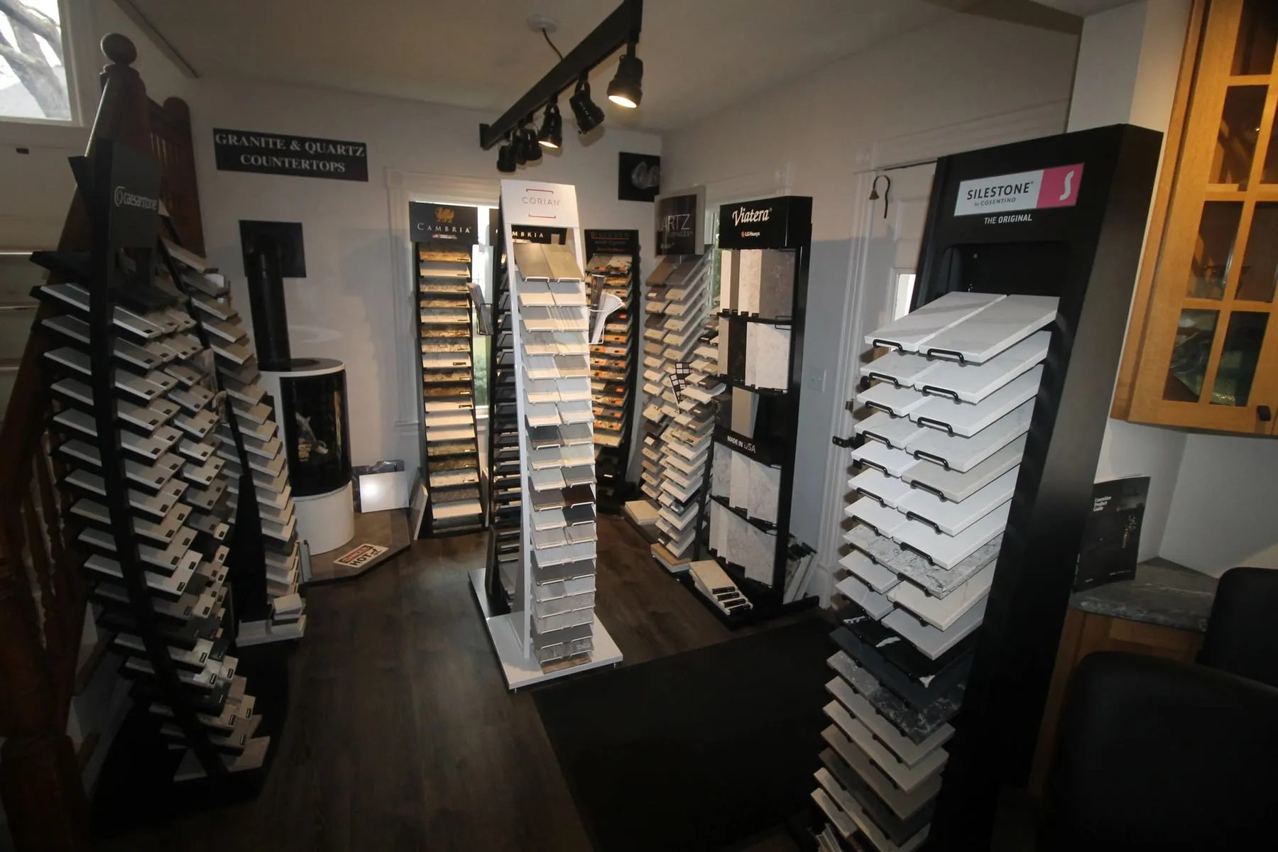 Racks of granite and quartz countertop samples in the Pondside showroom in Deep River