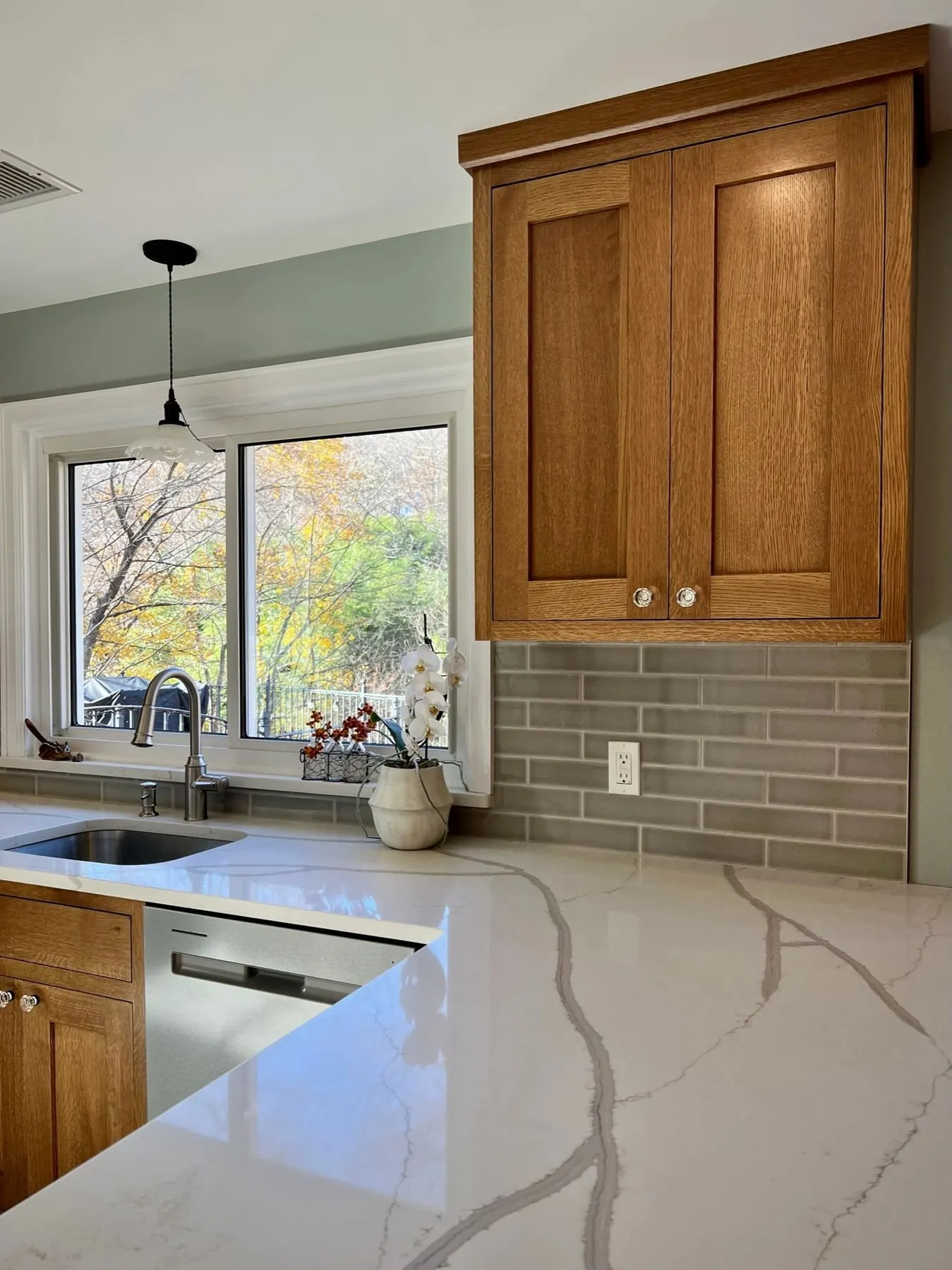 White oak kitchen looking toward the sink and dishwasher in Deep River CT