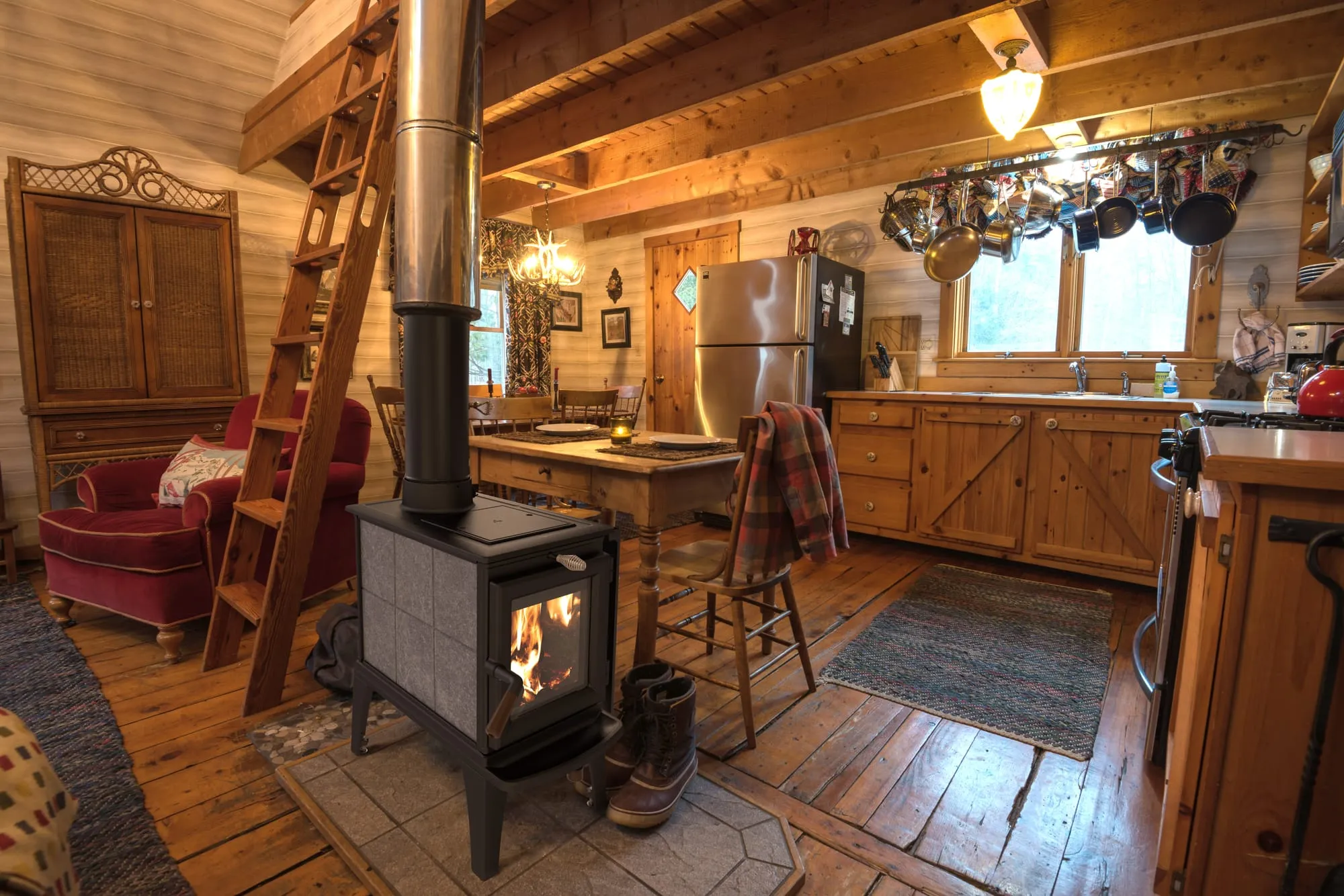 Hearthstone Lincoln 8060 soapstone wood stove in an open timber-framed kitchen