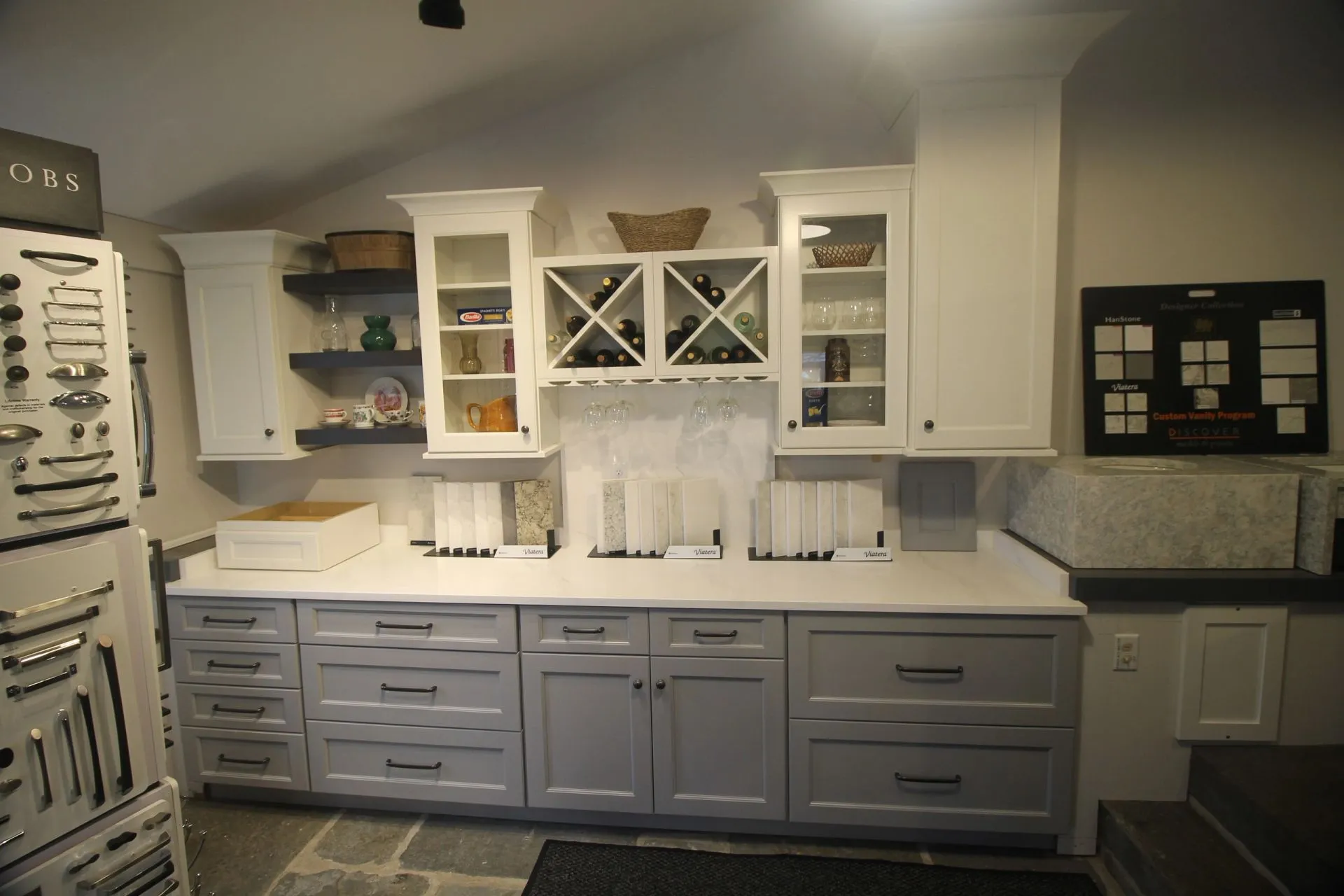White and grey kitchen cabinetry on display in the Pondside Kitchens showroom